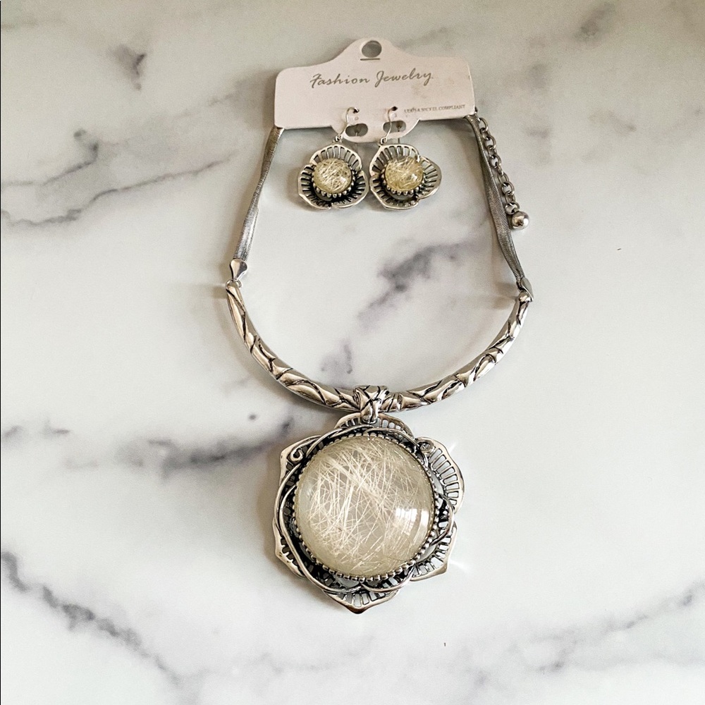 Silver necklace with earrings.